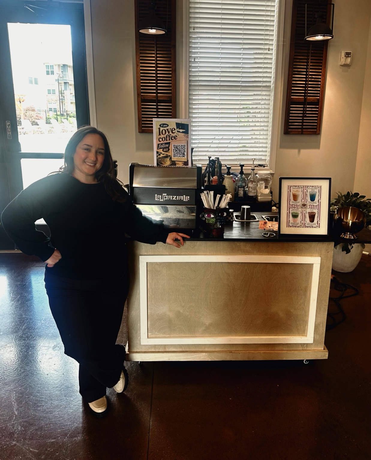 Alexis smiling beside her Brew Velvet coffee cart